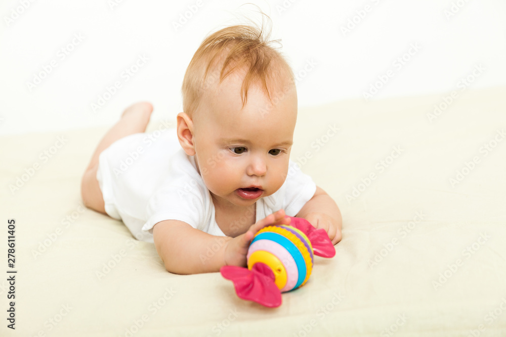Portrait of happy smile baby relaxing on the bed Portrait of happy smile baby relaxing on the bed