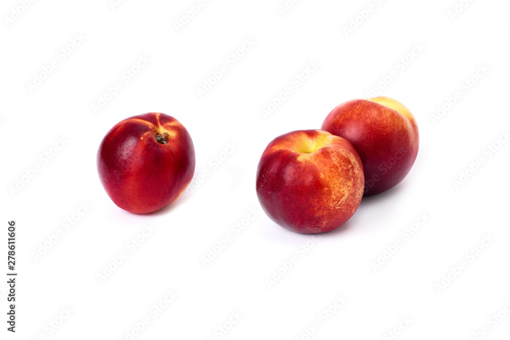 Three red bald peaches on white background. Peaches close up red color. Three red bald peaches on white background. Peaches close up red color.
