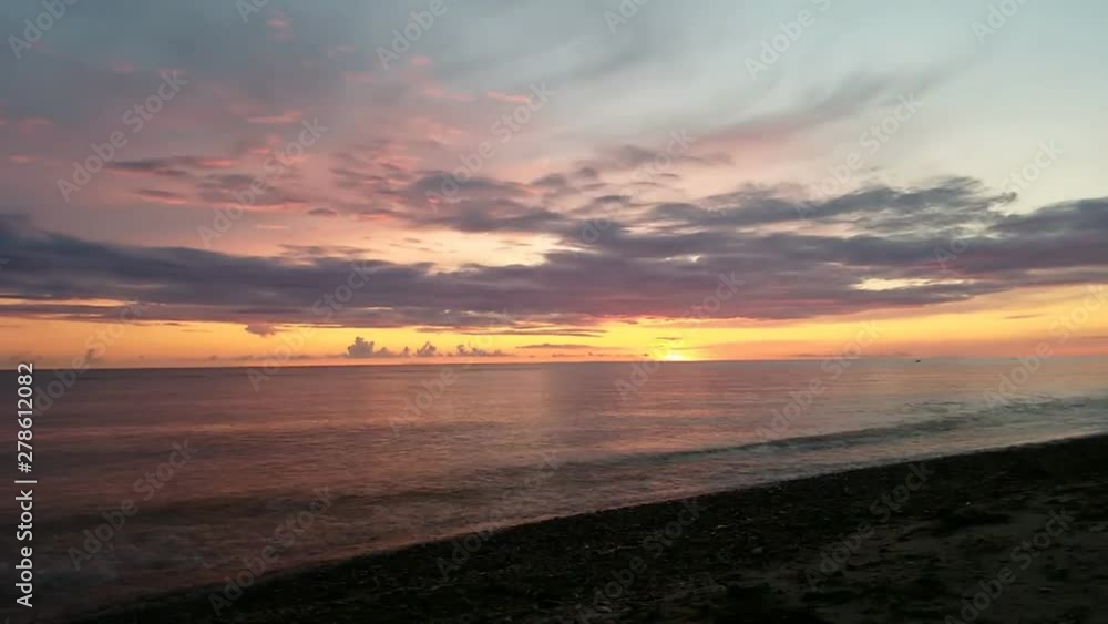 Beautiful multicolored sunset over sea. Sunny path reflecting the sunset in the Baltic sea. Timelapse. No sound. Beautiful multicolored sunset over sea. Sunny path reflecting the sunset in the Baltic sea. Timelapse. No sound.