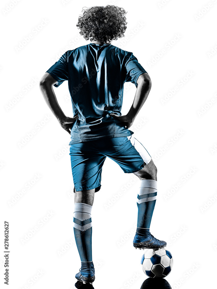 one mixed race young teenager soccer player man playing in silhouette isolated on white background one mixed race young teenager soccer player man playing in silhouette isolated on white background