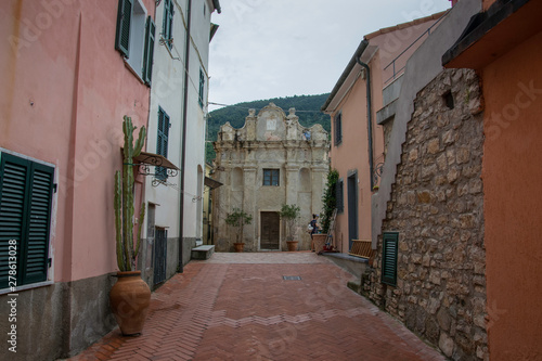 Fototapeta Naklejka Na Ścianę i Meble -  Ancient stone church in a street of italian town in Liguria
