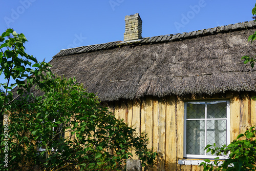 traditional old fishermans wooden house with reed roof