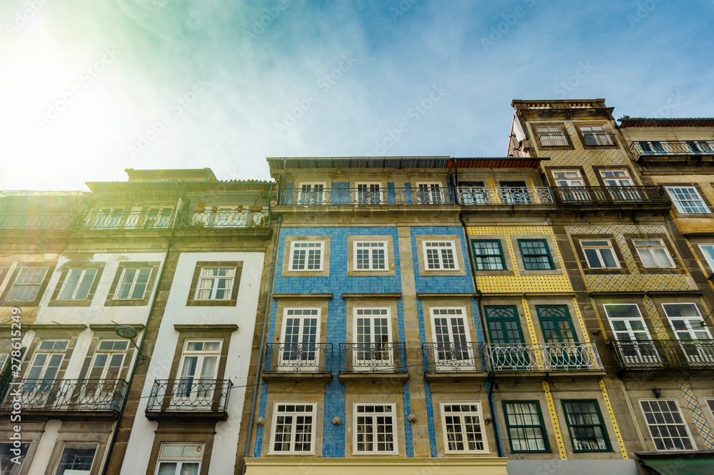 Obraz premium Street view on the old buildings with portuguese tiles on the facades in Porto