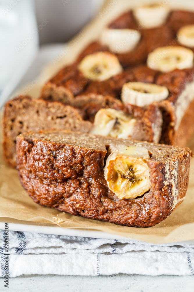 Homemade sliced banana bread on a white background. Homemade sliced banana bread on a white background.