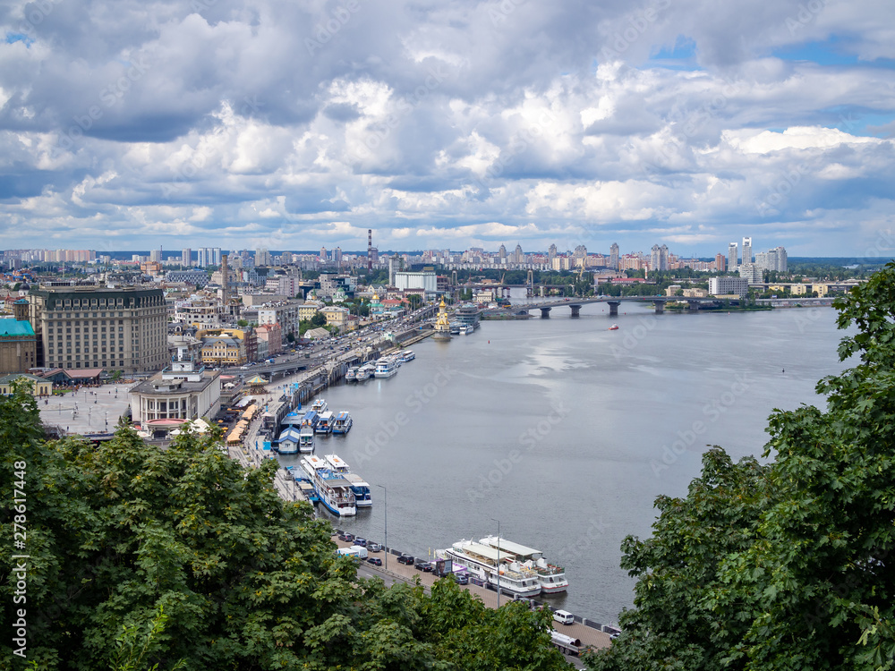 Observation desk aerial view of the Dnieper river in the centre of Kiev, Ukraine, cloudy dramatic sky