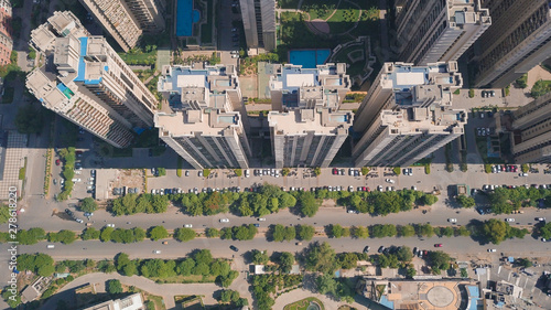 Top down aerial view of multistoreys buildings of ATS society by the main road in day light, Indrapuram, Delhi ncr, India. photo