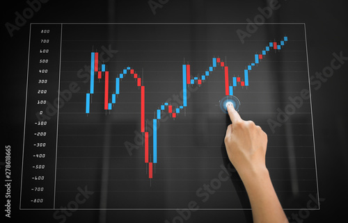 technology, exchange market and economy concept - hand using black interactive panel with forex chart