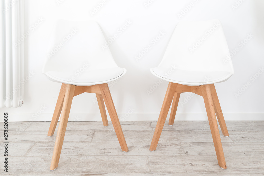 Scandinavian style chairs and indoor plants 