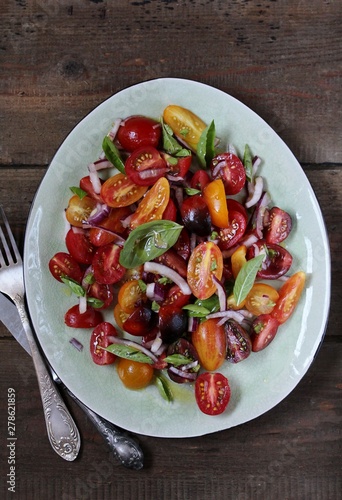  cherry tomatoes salad of different colors and basil. bright summer salad.  © shabbydecor