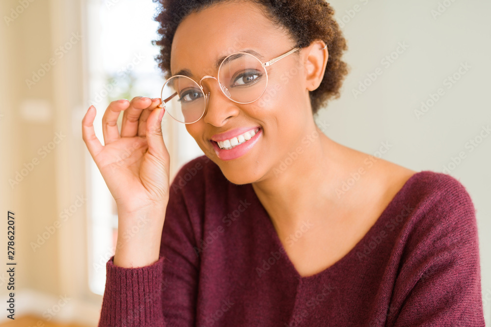 Beautiful young african woman with afro hair wearing glasses Beautiful young african woman with afro hair wearing glasses