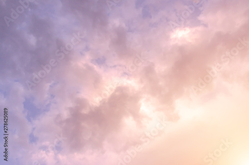Thick fluffy pink sunset clouds background
