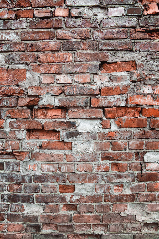 Fototapeta premium Wall or fence of old red brick. Background