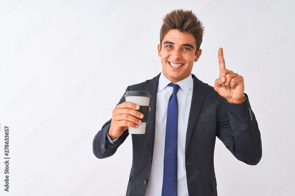 Young handsome businessman wearing suit holding coffee over isolated white background surprised with an idea or question pointing finger with happy face, number one Young handsome businessman wearing suit holding coffee over isolated white background surprised with an idea or question pointing finger with happy face, number one