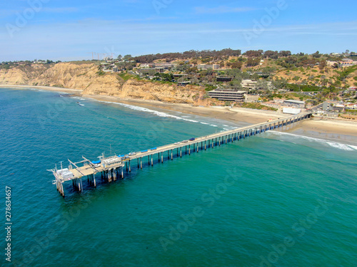 Aerial view of the scripps pier institute of oceanography, La Jolla, San Diego, California, USA. Research pier used to study ocean conditions and marine biology. Pier with luxury villa on the coast.