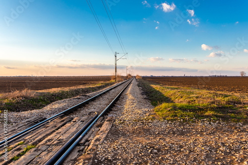 Railway line between the agricultural fields in March