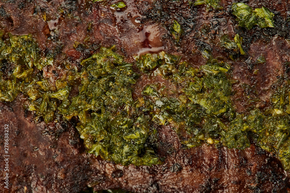 Chimichurri herbs on steak meat