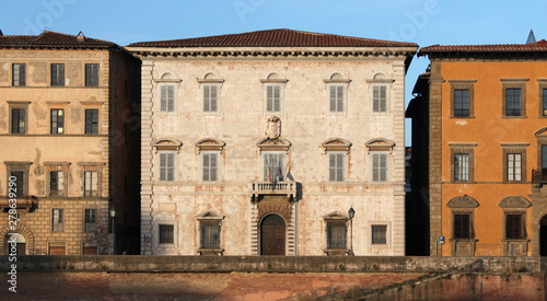Palazzo Toscanelli facade elevation in the evening sun in Pisa, Italy
