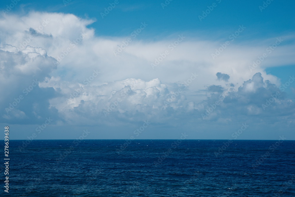 Rain clouds over the calm sea