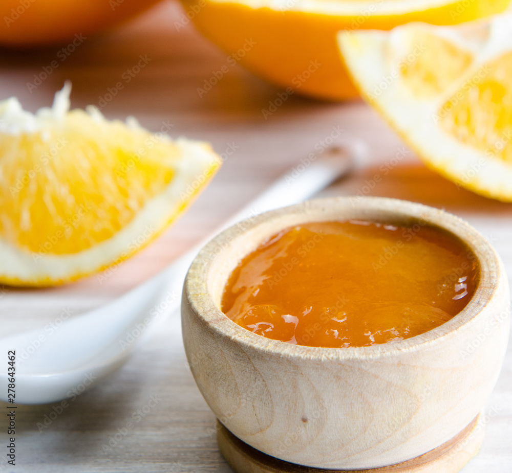 Orange jam served in spoon on the table Orange jam served in spoon on the table