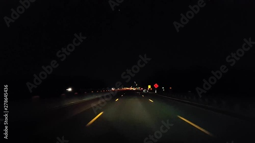 Driving Highway During the Evening.  Driver Point of View POV Interstate Drive at Night.  Freeway or Motorway or Turnpike or Expressway.