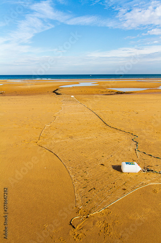 Discarded fishing net on Omaha Beach in Normandy, France