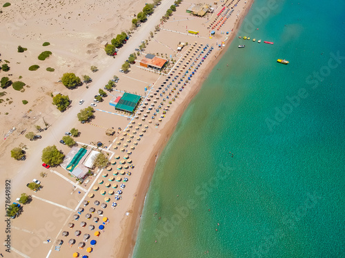 Aerial birds eye view drone photo Tsambika beach near Kolympia on Rhodes island, Dodecanese, Greece. Sunny panorama with sand beach and clear blue water. Famous tourist destination in South Europe photo
