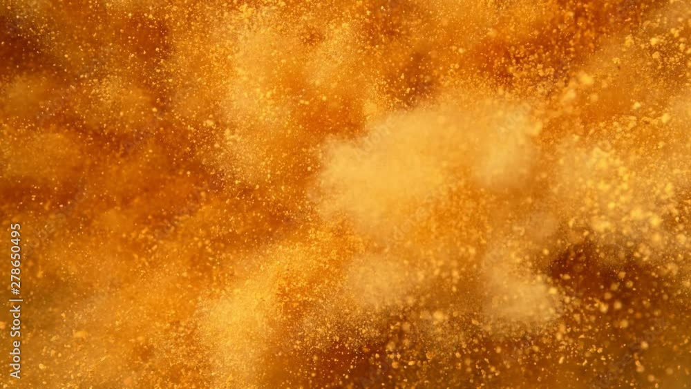 Super Slowmotion Shot of Golden Powder Explosion at 1000fps. Super Slowmotion Shot of Golden Powder Explosion at 1000fps.