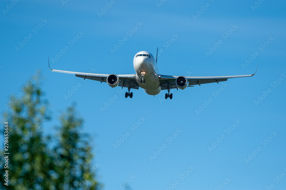 Landing airplane silhouette on final approach at EFHK