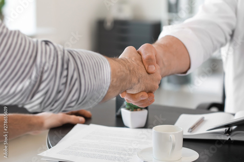Man shaking hand of notary ...