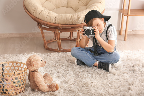 Cute little photographer wi...