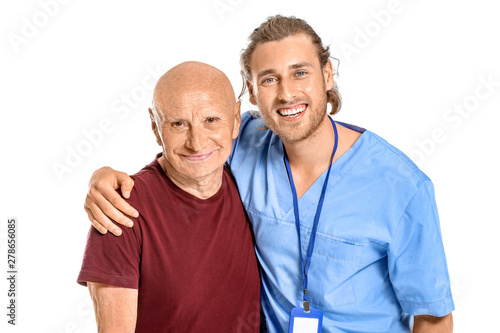 Elderly man with caregiver ...