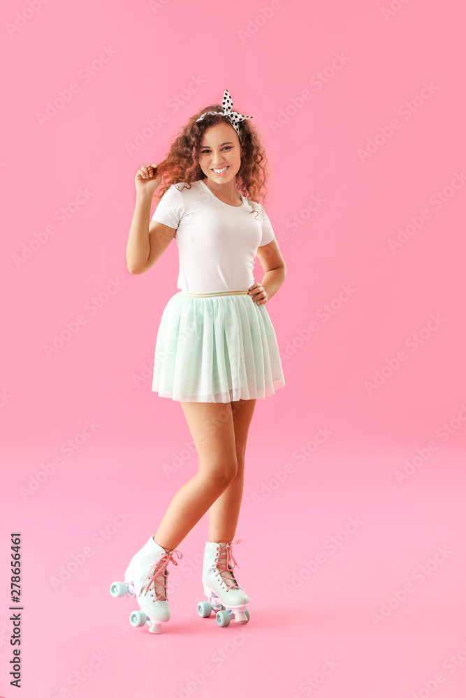 Beautiful young woman on roller skates against color background Beautiful young woman on roller skates against color background