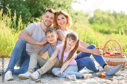 Happy family on summer picn...