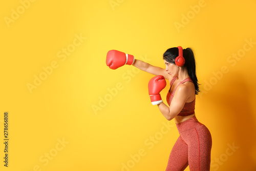 Sporty female boxer with he...