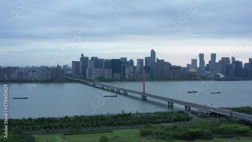 aerial view of bridge over the river and skyline in hangzhou, china