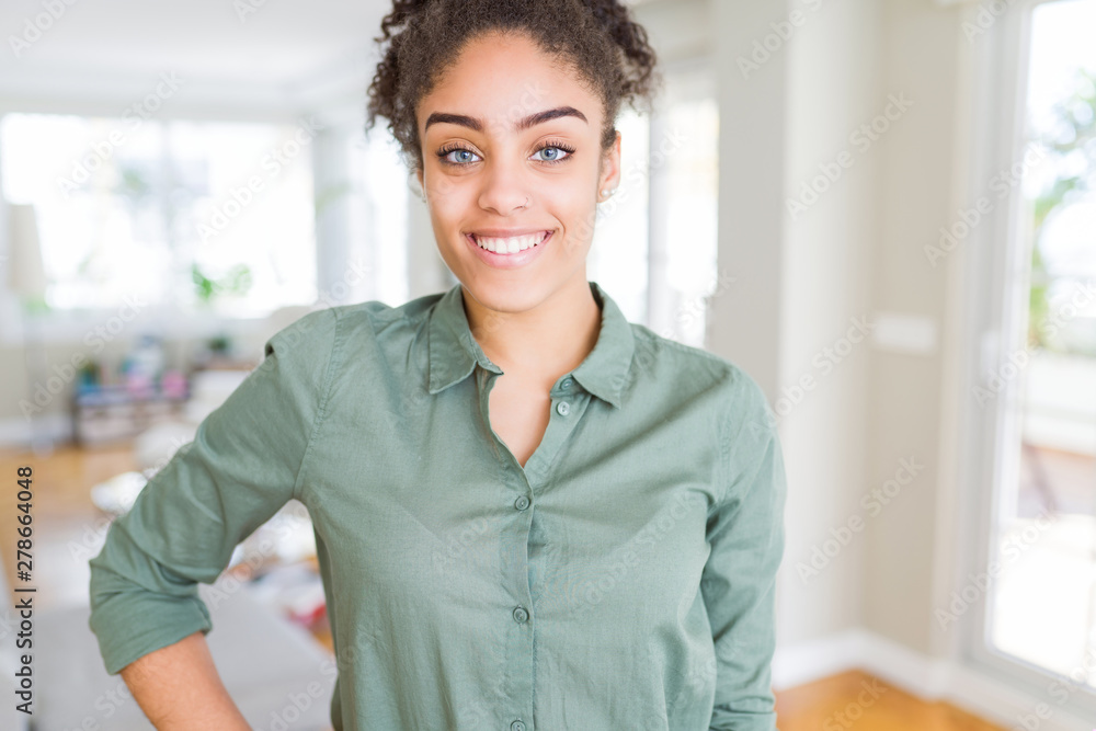 Beautiful young african american woman smiling cheerful, friendly face laughing confident