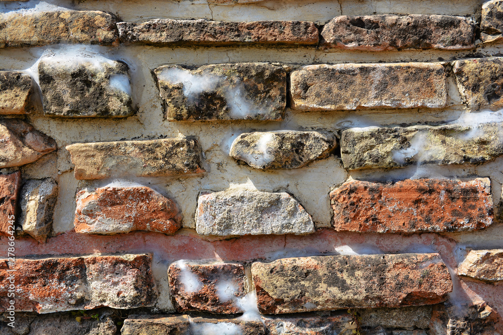 Masonry stone wall in the ancient city of side in Turkey. Natural stone background Masonry stone wall in the ancient city of side in Turkey. Natural stone background