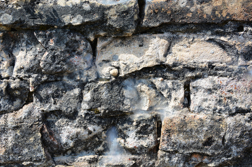 Masonry stone wall in the ancient city of side in Turkey. Natural stone background