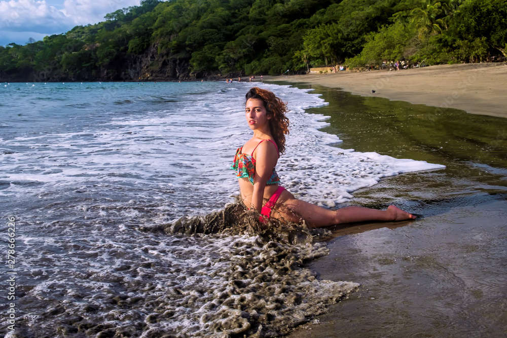 Fototapeta premium young woman on the beach