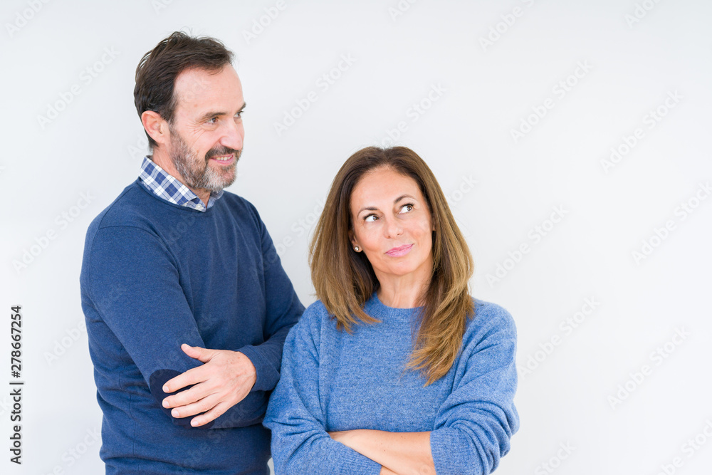 Beautiful middle age couple in love over isolated background smiling looking side and staring away thinking. Beautiful middle age couple in love over isolated background smiling looking side and staring away thinking.