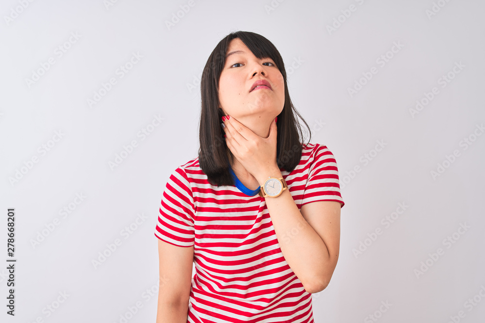 Young beautiful chinese woman wearing red striped t-shirt over isolated white background Touching painful neck, sore throat for flu, clod and infection Young beautiful chinese woman wearing red striped t-shirt over isolated white background Touching painful neck, sore throat for flu, clod and infection