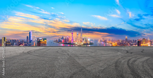 Empty race track and modern city skyline in Shanghai at sunset China