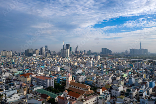 Arieal photography of Church, rooftops, architecture and view to City Skyline and River .Ho Chi Minh City Vietnam