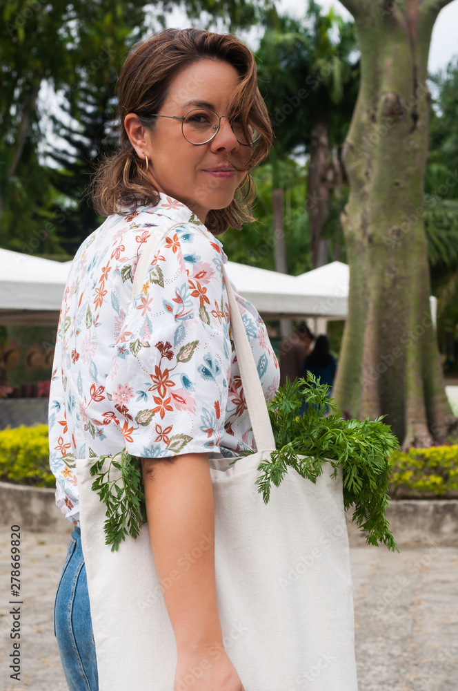 Woman with a shopping bag for organic vegetables Woman with a shopping bag for organic vegetables