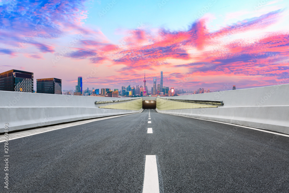 Fototapeta premium Empty asphalt highway and modern city skyline in Shanghai at sunset,China