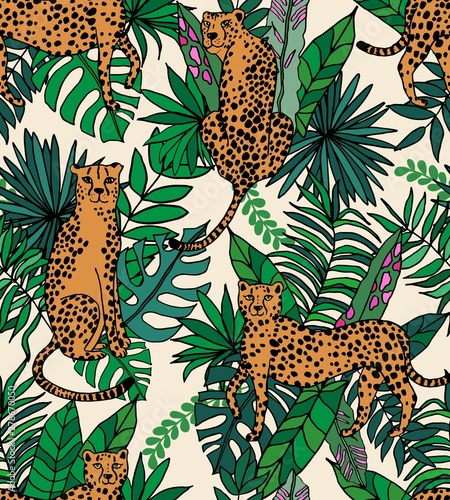 Seamless repeat pattern with cheetah or leopard in tropical jungle leaves