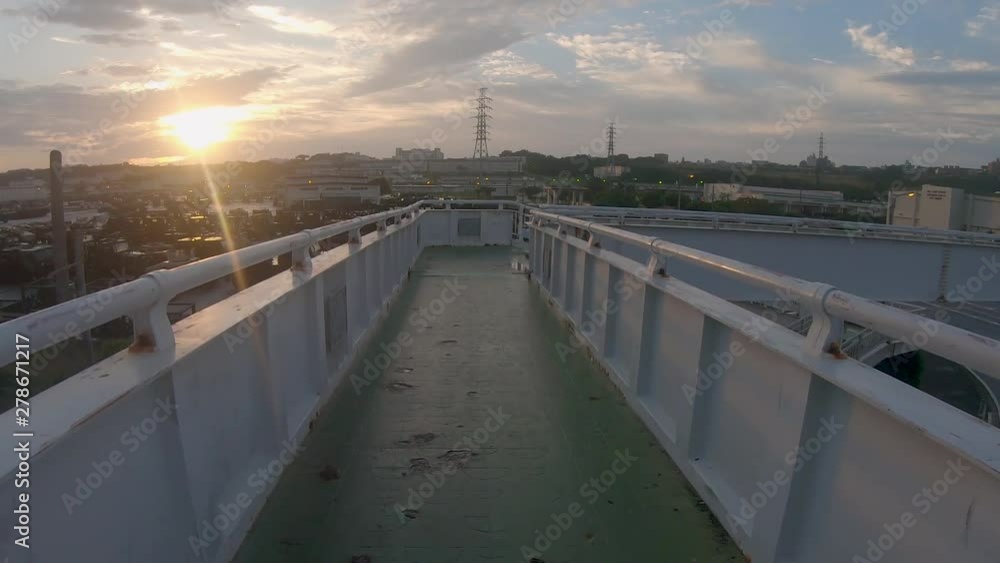 Point Of View. Walking Over Foot Bridge with Sunrise Over Camp Foster, American Military Base in background, Point Of View. Walking Over Foot Bridge with Sunrise Over Camp Foster, American Military Base in background,