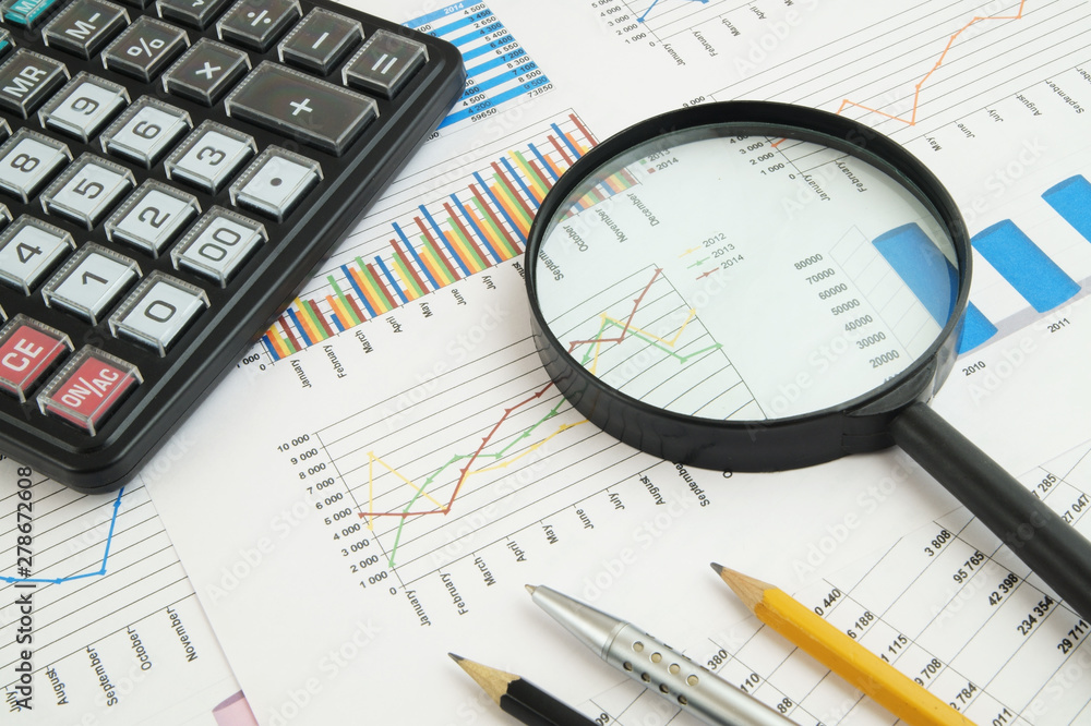 Business concept with charts, graphs and calculator Business concept with charts, graphs and calculator