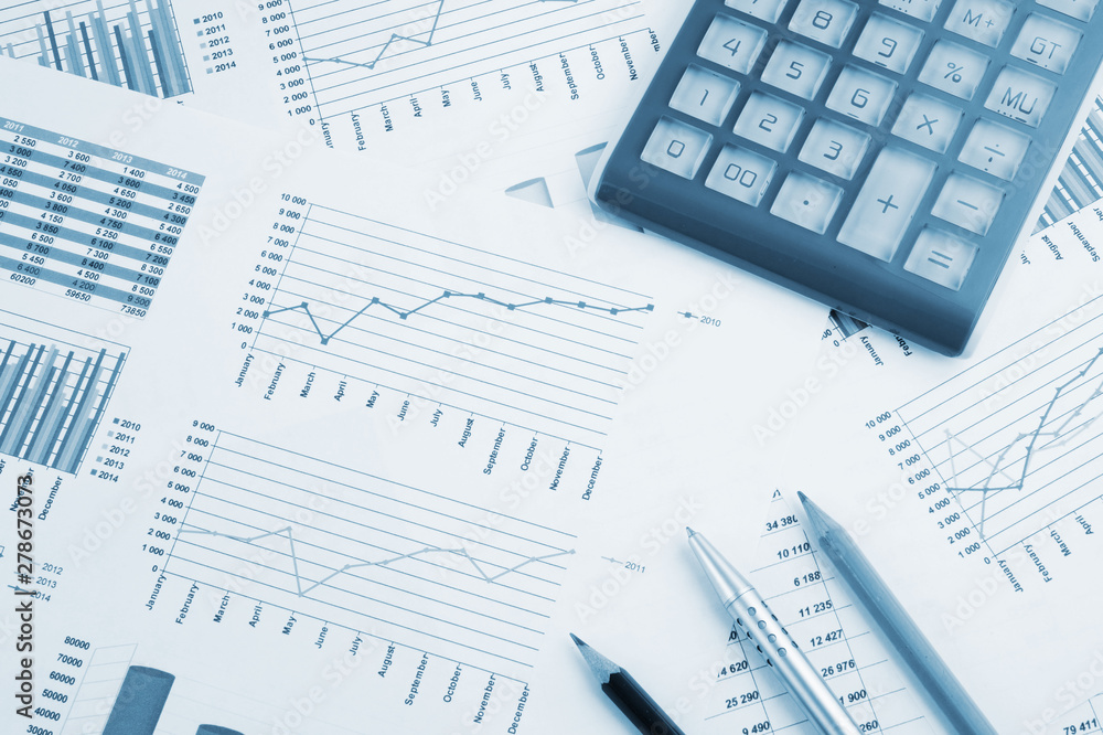 Business concept, calculator on financial documents Business concept, calculator on financial documents