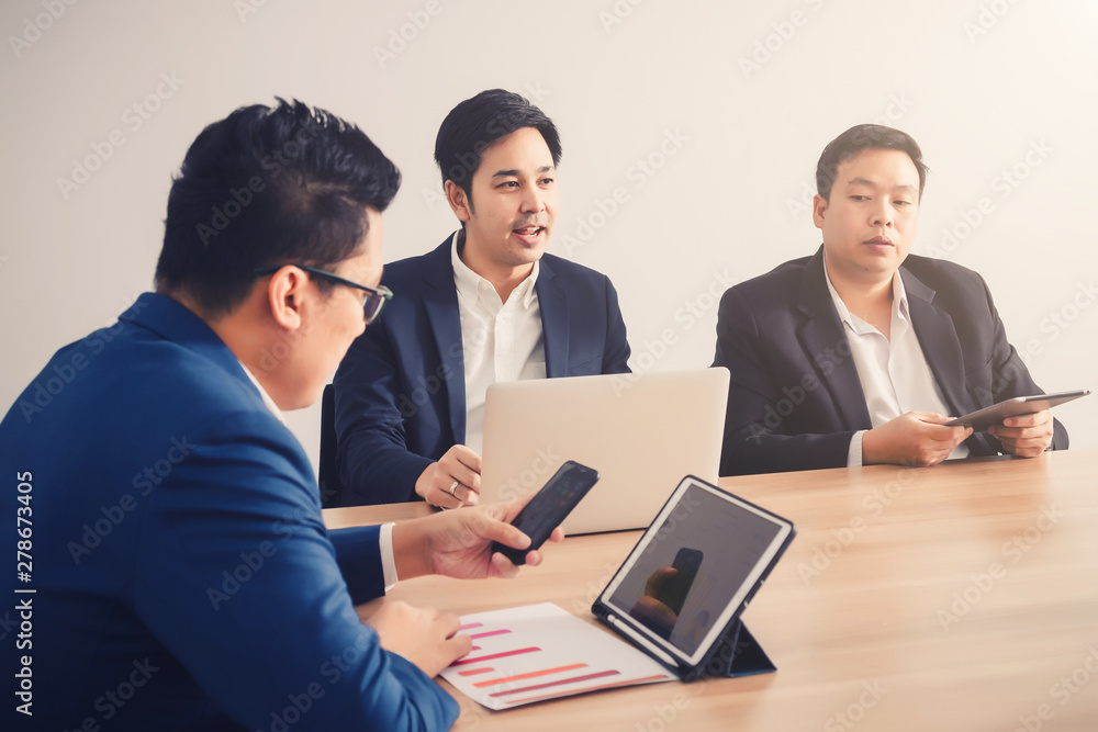 Businessman serching data with smartphone between meeting corporate success brainstorming Businessman serching data with smartphone between meeting corporate success brainstorming